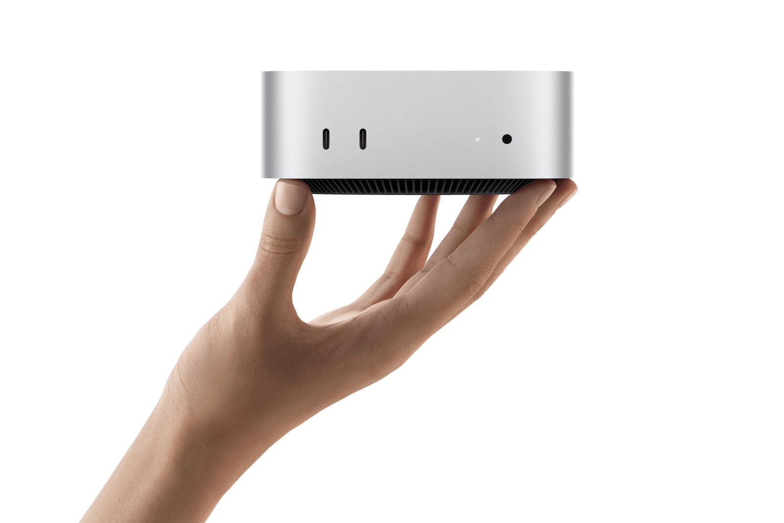 UNA MANO SOSTENIENDO LA MAC MINI 2026